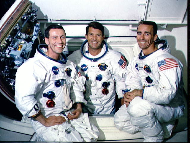 The crew of Apollo 7 wearing spacesuits are photographed during training