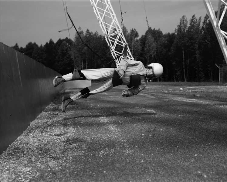 Cunningham is suspended almost horizontally during early reduced gravity simulations at Langley Research Center