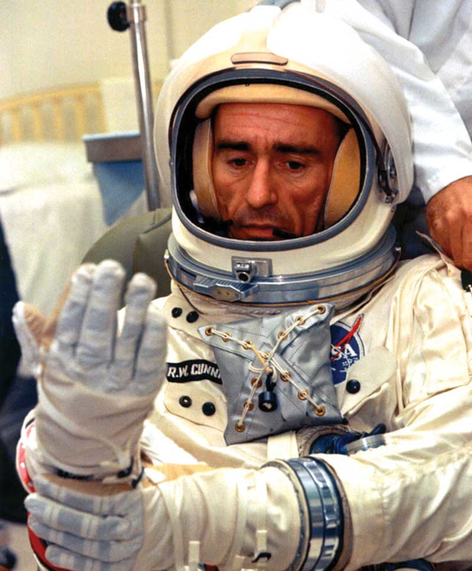 Cunningham dressed in full spacesuit with open helmet