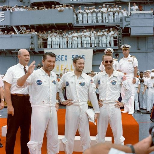 the apollo 7 crew stands aboard the prime recovery vessel at the end of their mission