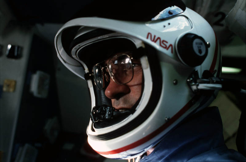 Fabian wears a launch and entry helmet during preparations for re-entry on sts-7