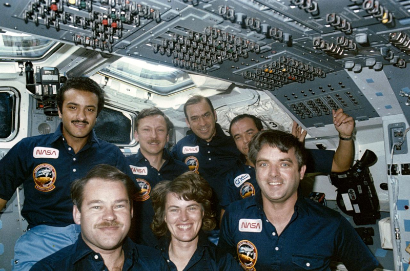 the seven-person crew of Fabian's second mission pose for the camera.
