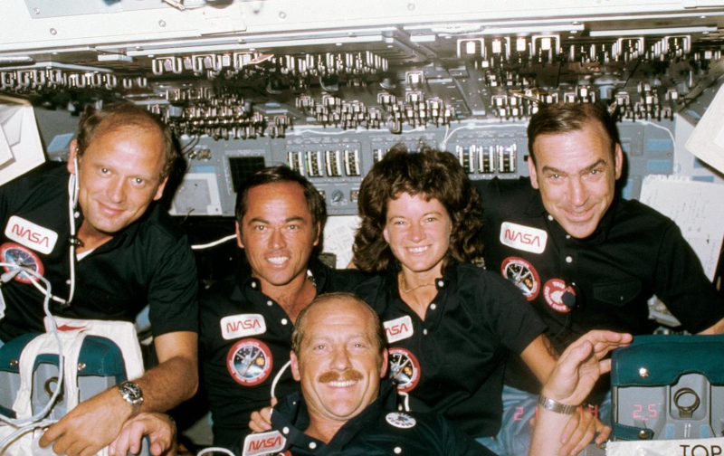 the five people aboard STS-7 in 1983 pose for the camera for a crew shot.