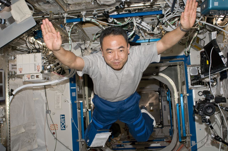 in a classic microgravity pose with arms outstretched, Furukawa floats through the Destiny Laboaratory aboard ISS during his stay in Expedition 28.