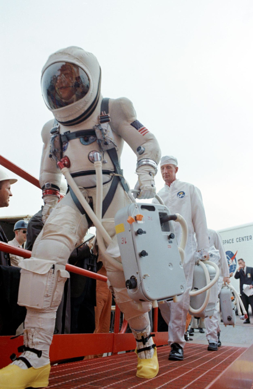 Astronaut Jim Lovell walks up the ramp to the elevator on the launch pad