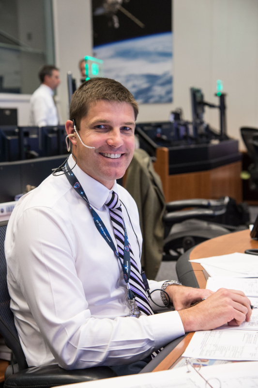 A smiling Jeremy Hansen at the Capcom console during ISS Expedition 47 in 2016