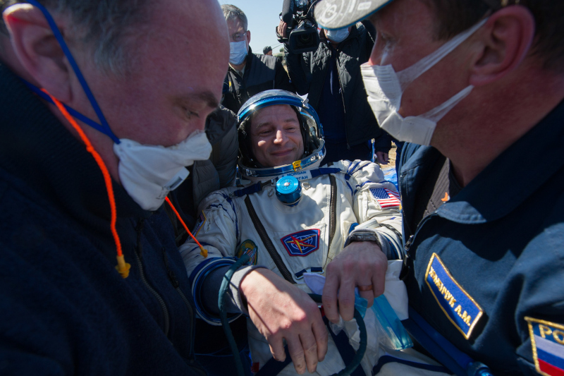 morgan is helped out of the Soyuz spacecraft on his return from ISS after 271 days in space