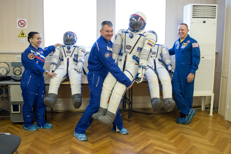samokutyaev and his Expedition 41 colleagues enjoy a lighter moment with their spacesuits at Baikonur Cosmodrome